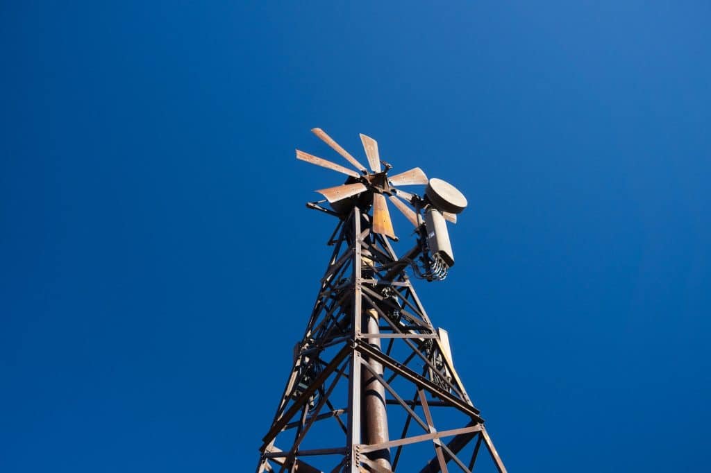 Cell phone antenna on a vintage style metal wind mill