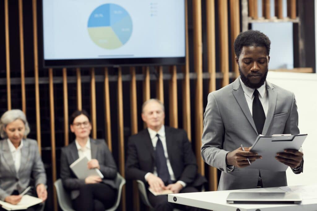 Young businessman preparing for public speech